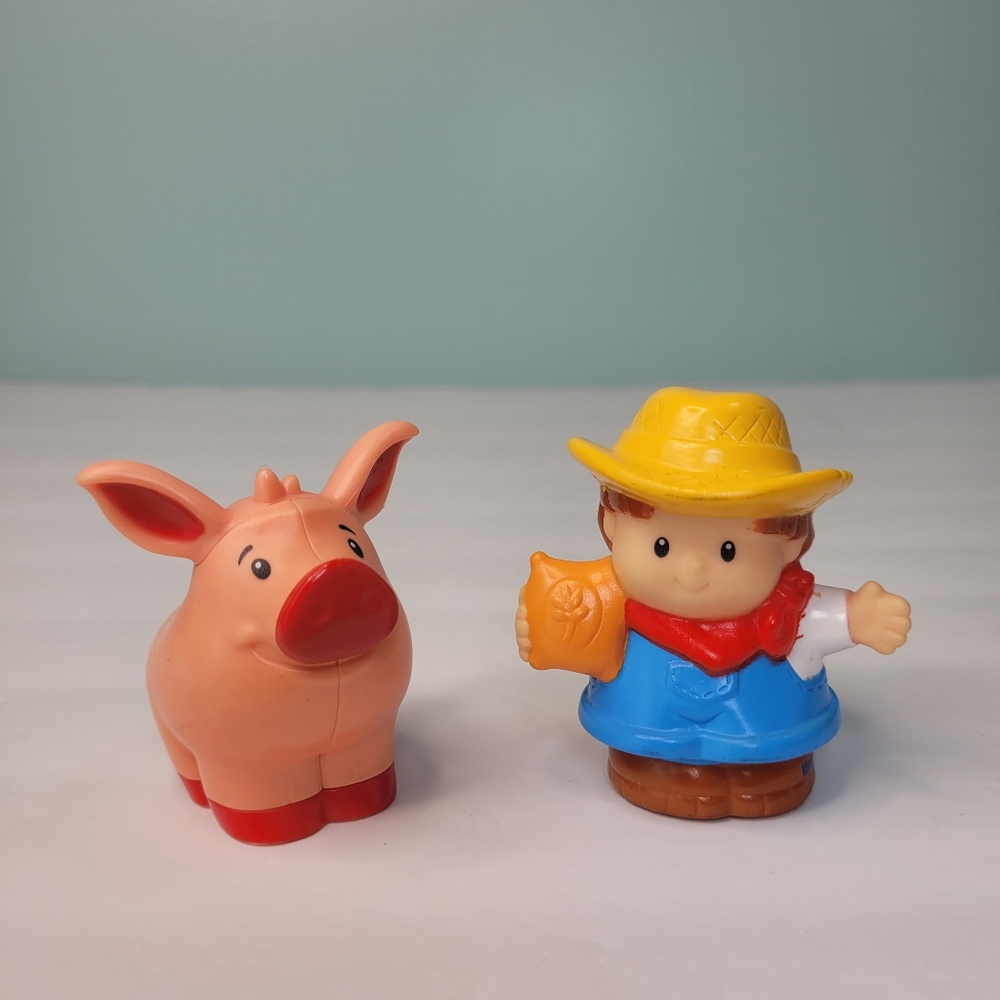Fisher Price Little People Farmer holding bag of seed and Pig Lot of 2
